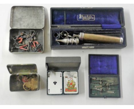 A tray containing a small tin of badges; a set of Orient Line To Australia playing cards; a small tin of lead figures etc.