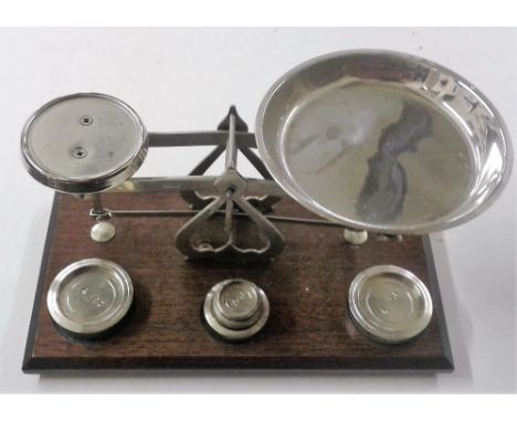 A pair of postal scales and weights 