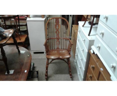 An elm and yew wood stick back Windsor rocking chair 