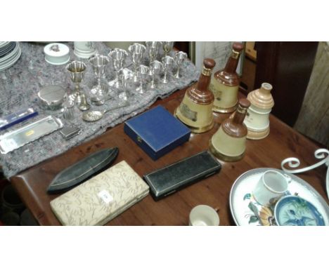 Four whisky decanters; together with a quantity of cased cutlery; an Aynsley preserve dish; a small presentation trowel in fi