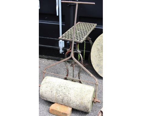 A wrought iron and sandstone garden roller, 60cm W, along with a cast iron sewing machine stand, 74cm H x 71cm W (2) 