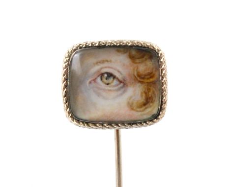 An 18th century style ‘Lovers Eye’ stick pin, the ivory portrait miniature depicting hazel eye and ringlet hair, within gold 