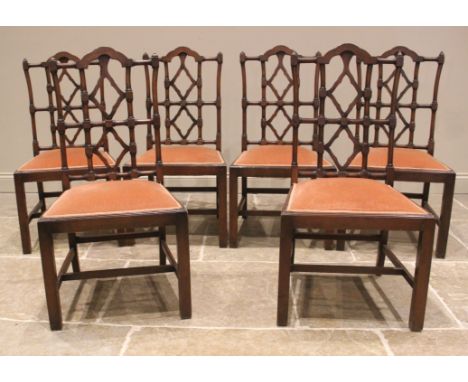A set of eight mahogany dining chairs, in the George III Chinese Chippendale style, 20th century, each with a break arch top 