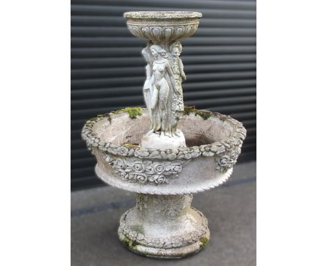 A reconstituted stone two-tier water feature/planter, the associated upper tier modelled as a bowl upon an integral figural p