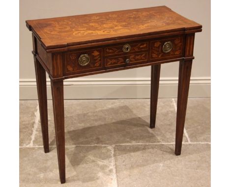 A Dutch marquetry mahogany and satinwood inlaid card table, late18th/early 19th century, the rectangular folding top with pro