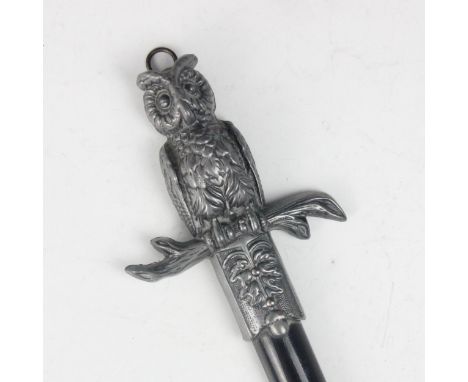 A novelty hanging thermometer, designed as a sword with owl shaped hilt and oak leaf detailed terminal, with applied brass pl