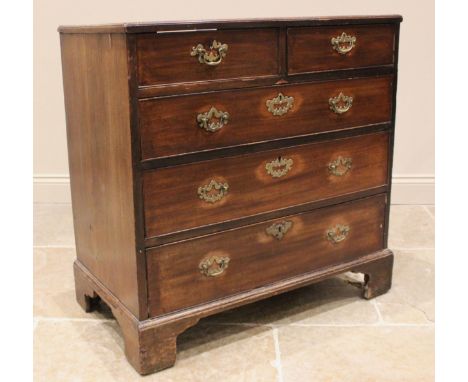 A George III mahogany chest of drawers, formed with two short over three long graduated drawers, oak lined running front to b