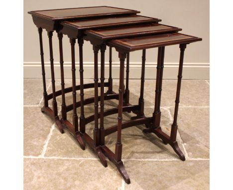 An Edwardian quartetto nest of mahogany tea tables, each table with a beaded gallery and satinwood crossbanded perimeter, upo