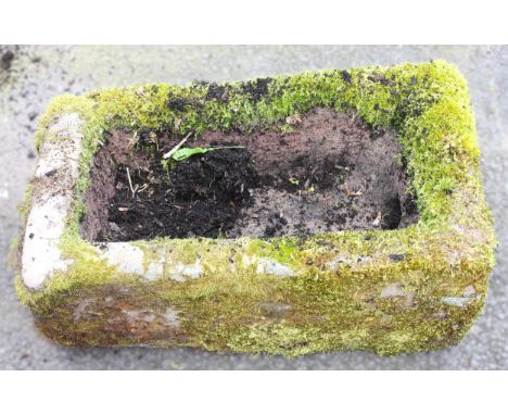 A 19th century sandstone trough, of rectangular form with drain hole to the side, 24cm H x 65cm W x 39cm D 