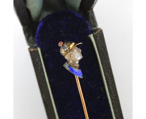 A French carved untested moonstone, diamond and enamel stick pin, the head designed as a side profile of a jockey, the cap an