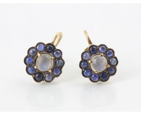 A pair of 20th century untested moonstone cluster earrings, the central circular cabochon cut untested moonstones within surr