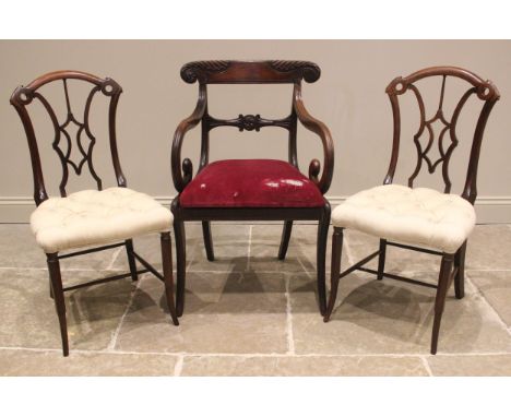 A pair of rosewood bedroom chairs, mid 19th century, each formed with an arched top rail extending to paper scroll terminals 