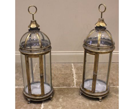 A pair of glazed brass lantern form candle holders, late 20th/early 21st century, of domed, hexagonal architectural form, wit