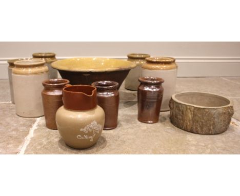 A glazed stoneware advertising jug applied with the Cadbury tree logo and name, 17cm high, a glazed stone ware cream bowl, 18