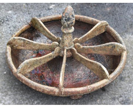 A 19th century circular cast iron feed trough, the acorn shaped finial over eight divisions 60cm D 