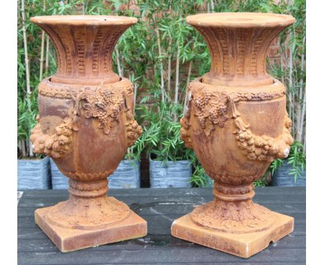 A pair of copmposite fibreglass simulated terracotta garden water features, modelled as garden urns with removable covers, 88