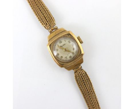 A yellow metal ladies Rotary wristwatch, the circular dial with Arabic numerals, within a plain polished shaped case, upon 9c
