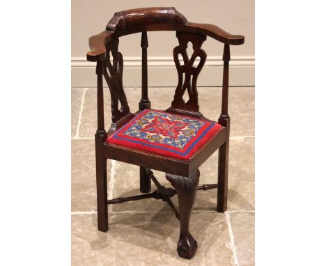 A Chippendale revival child's mahogany corner chair, early 20th century, the curved top rail upon a pair of pierced splats pu