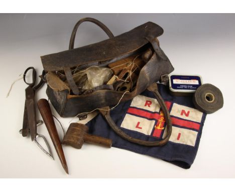 A sail maker's kit containing an Easy-Splice, shears, further tools and and a selection of threads, all to a leather tool bag