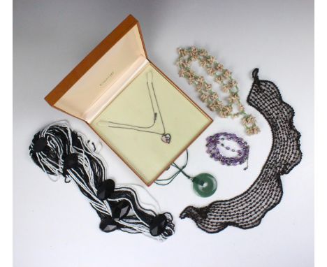 A selection of jewellery, including a Clogau silver and gold pendant, shaped as a heart with overlay detail, a group of cultu