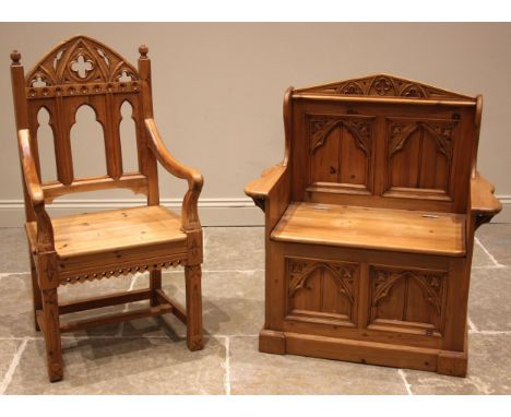 A Gothic influence pine box settle, late 20th century, the architectural back rest with quatrefoil motifs over arcaded panels