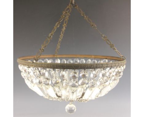 A brass and glass lustre basket light fitting, early 20th century, the bowl shaped shade formed with a brass rim and hanging 