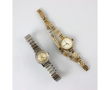 A yellow metal cased Rotary ladies wristwatch, the circular white dial with baton markers, within plain polished case, stampe