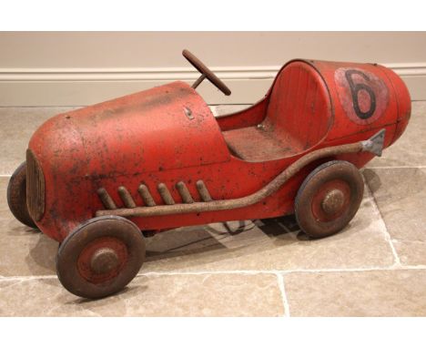 A pedal car in the style of a 1930's single seater racing car, mid 20th century, the car of bullet form, with a  projected re