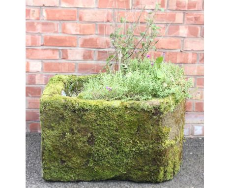 A 19th century sandstone water pump trough, of typical bowfront form, 46cm H x 73cm W x 60cm D 