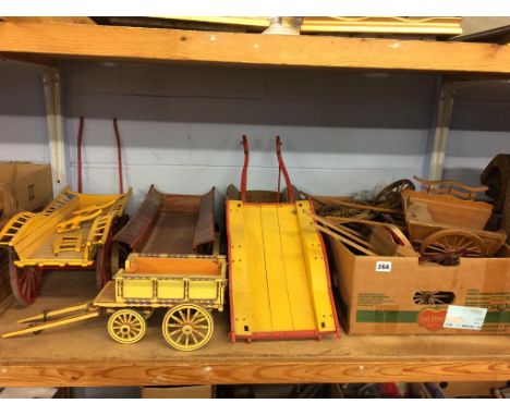 A quantity of part wooden model carts