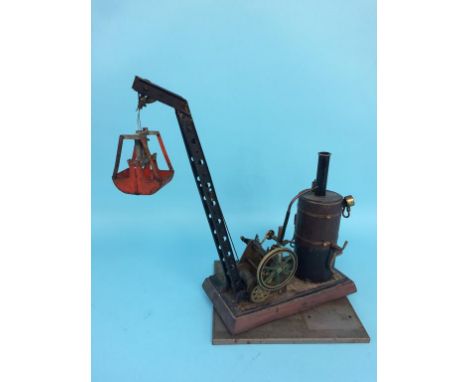 A model spirit fired single cylinder revolving crane and grab, 26cm width x 43cm height