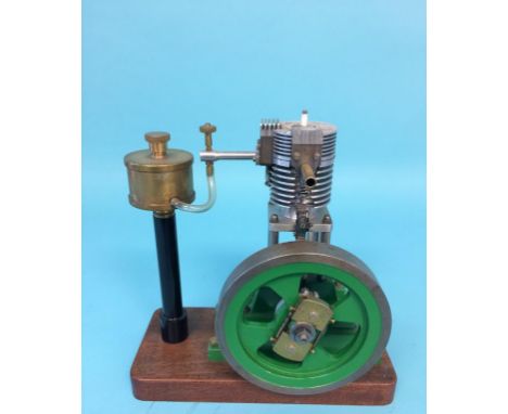A modern vertical single petrol engine, 23cm width x 24cm height