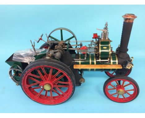 A live 1 inch scale Showman's model traction engine, Chas. Burrell and Sons Ltd, Compound Engine, Thetford.  64cm length x 40