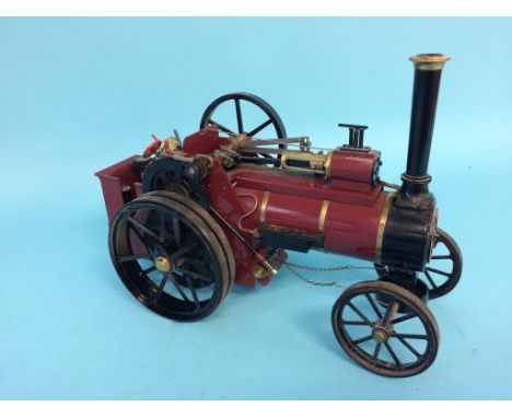 A small butane driver traction engine labelled W.M. Allchin Ltd, Northampton, 31cm width