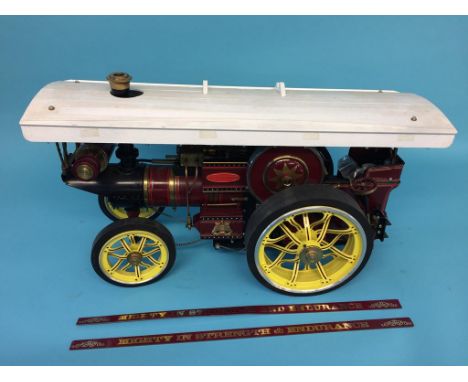 A live 1 inch scale Showman's steam traction engine, 'Iron Maiden', John Fowler and Sons Engineers, Leeds.  59cm width x 35cm