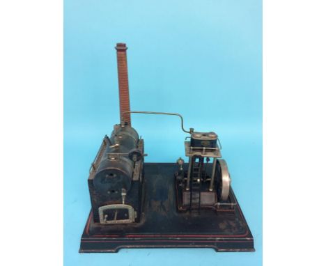 A twin cylinder model spirit fired engine and pump, labelled 'D.C. Made in Germany', 35cm width x 36cm height