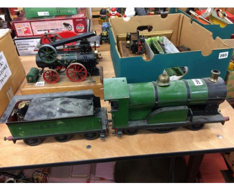 A live 2 and a half inch gauge steam model engine and tender