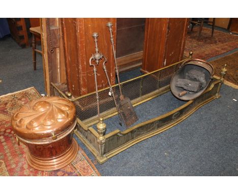 Copper coal scuttle of helmet type. Copper log box. Two brass fenders and steel fire irons.  Both fenders measure approximate