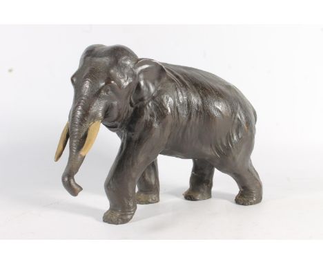 Japanese bronze model of an elephant with two character mark to the base, 33cm long.