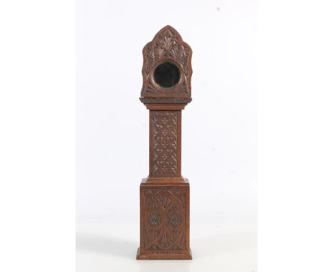Antique chip carved mahogany 'poor man's clock' pocket watch stand in the form of a miniature grandfather clock, 38cm tall.