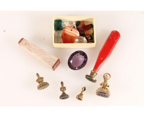 Yellow metal mounted intaglio seal fob, three others smaller, a green stone intaglio seal with flower and 'May You Possess It