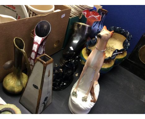 A selection of various pottery to include a Staffordshire style dog, fish decorated planter and horn ornament.