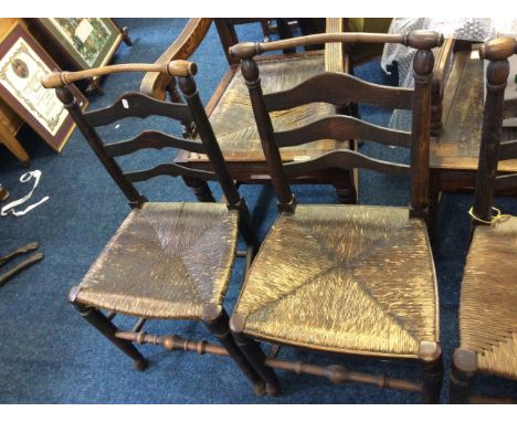 Four elm farmhouse ladder back chairs.