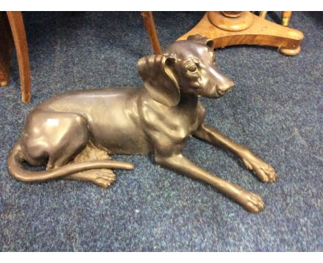 A bronze sculpture of a dog.