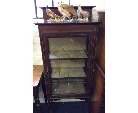 An Edwardian mahogany inlaid display cabinet with lead panel single door.