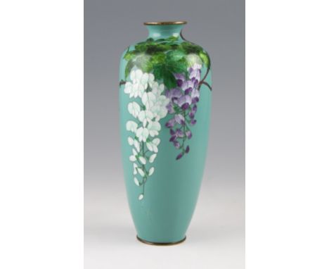 An early 20th Century Japanese enamel vase with hanging floral design to body with silver wire worked edges, all n turquoise 