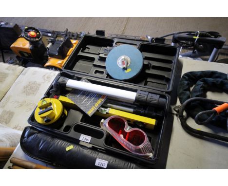 A cased laser level and a 30m Rabone Chesterman surveyors tape