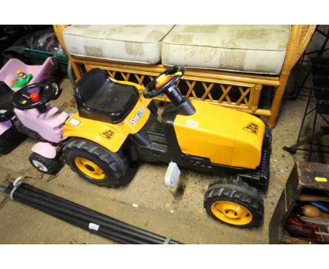 A child's pedal JCB tractor 