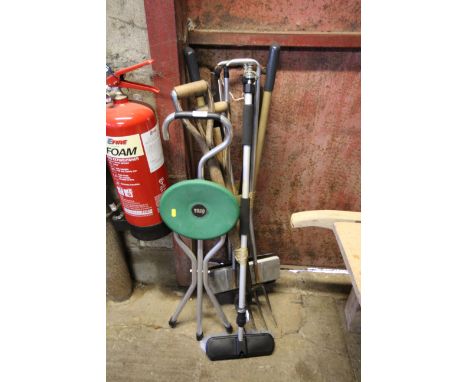 A walking stick seat and two bundles of garden tools etc.