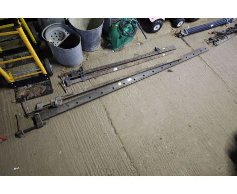 A large sash clamp and a smaller sash clamp